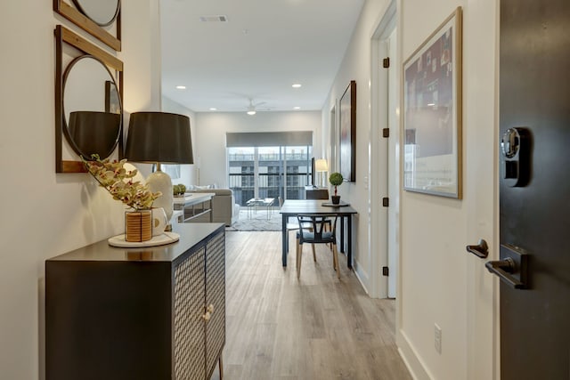 corridor featuring light hardwood / wood-style flooring