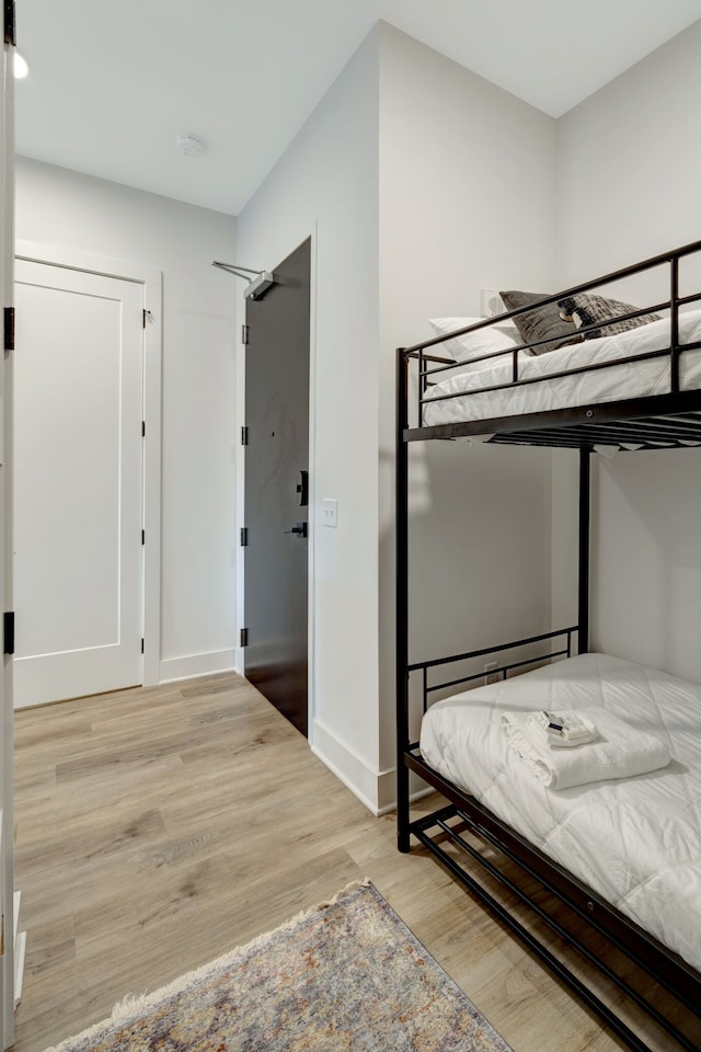 unfurnished bedroom featuring light wood-type flooring