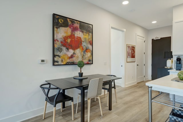 dining area with light hardwood / wood-style flooring