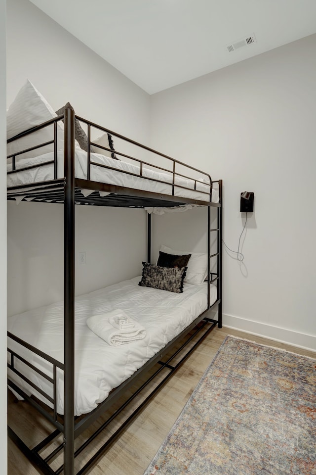 bedroom featuring light wood-type flooring