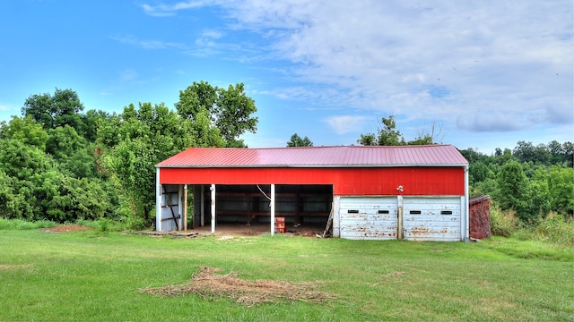 view of outdoor structure with a lawn