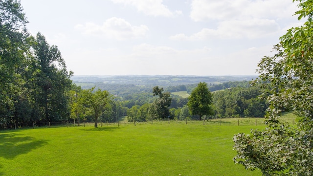 surrounding community featuring a rural view and a yard