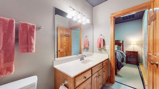 bathroom with oversized vanity and toilet