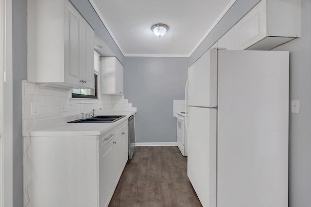 kitchen featuring white cabinets, ornamental molding, sink, white appliances, and dark hardwood / wood-style flooring