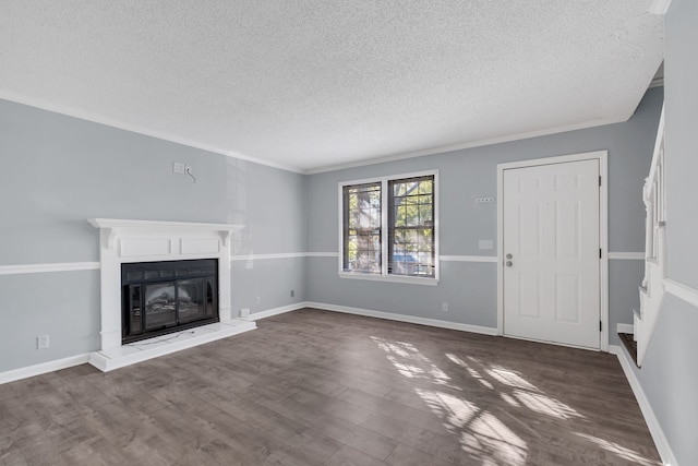 unfurnished living room featuring a textured ceiling, crown molding, and dark hardwood / wood-style flooring