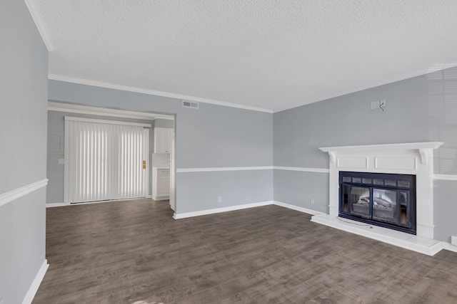 unfurnished living room with a textured ceiling, dark hardwood / wood-style floors, and crown molding