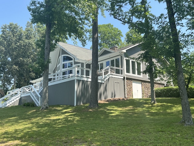 back of house featuring a yard