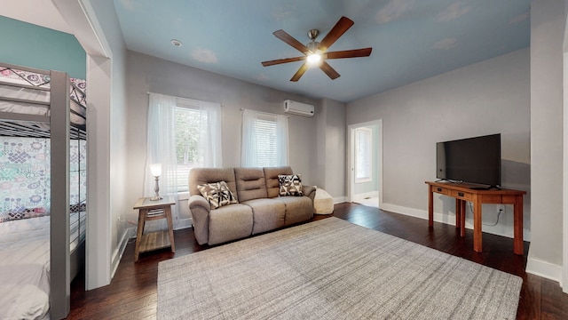 living room featuring a wall mounted AC, ceiling fan, and dark hardwood / wood-style floors