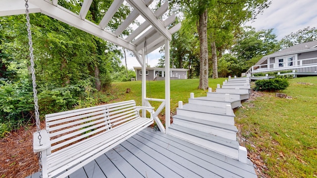 wooden terrace with a yard and a pergola