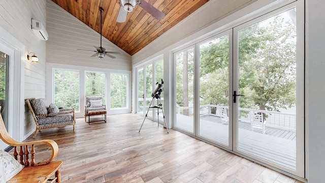 sunroom / solarium featuring wooden ceiling, a wall mounted air conditioner, ceiling fan, and vaulted ceiling