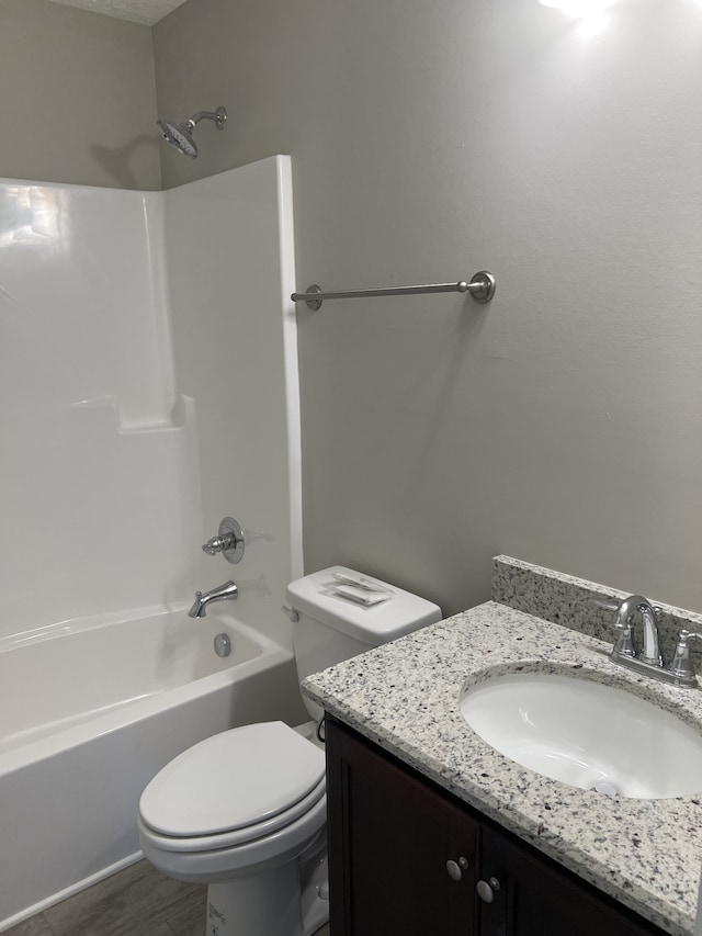 full bathroom featuring vanity, shower / bathtub combination, and toilet