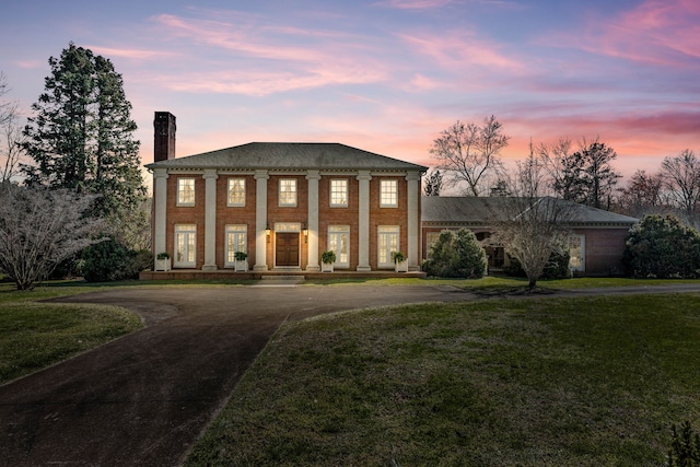 view of front of house with a yard