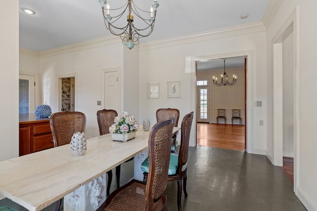 dining room with ornamental molding, dark hardwood / wood-style floors, and an inviting chandelier