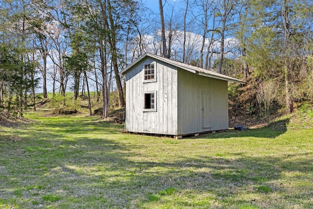 view of outdoor structure with a lawn