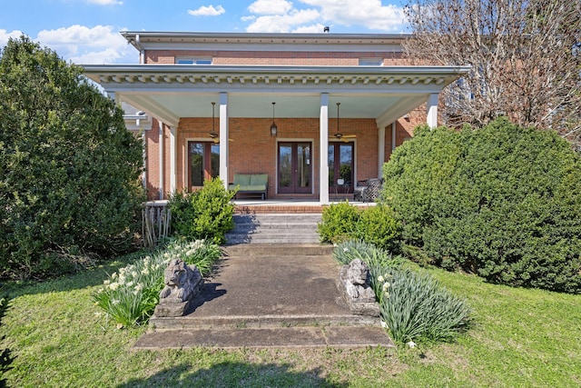 exterior space with a front lawn and a porch