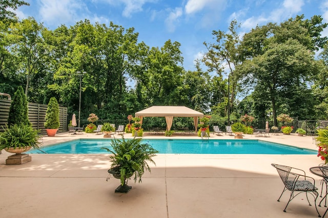 view of pool featuring a patio and a gazebo