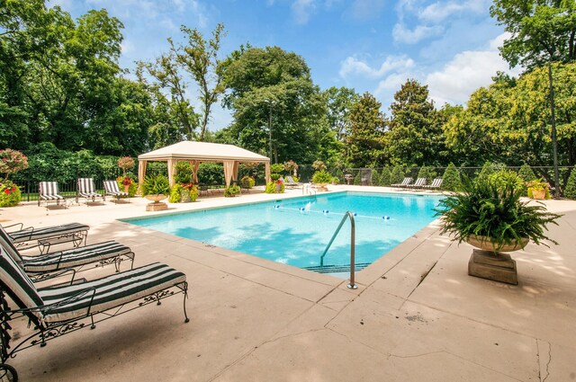 view of swimming pool featuring a gazebo and a patio area