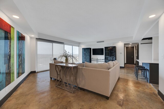 living room featuring concrete floors