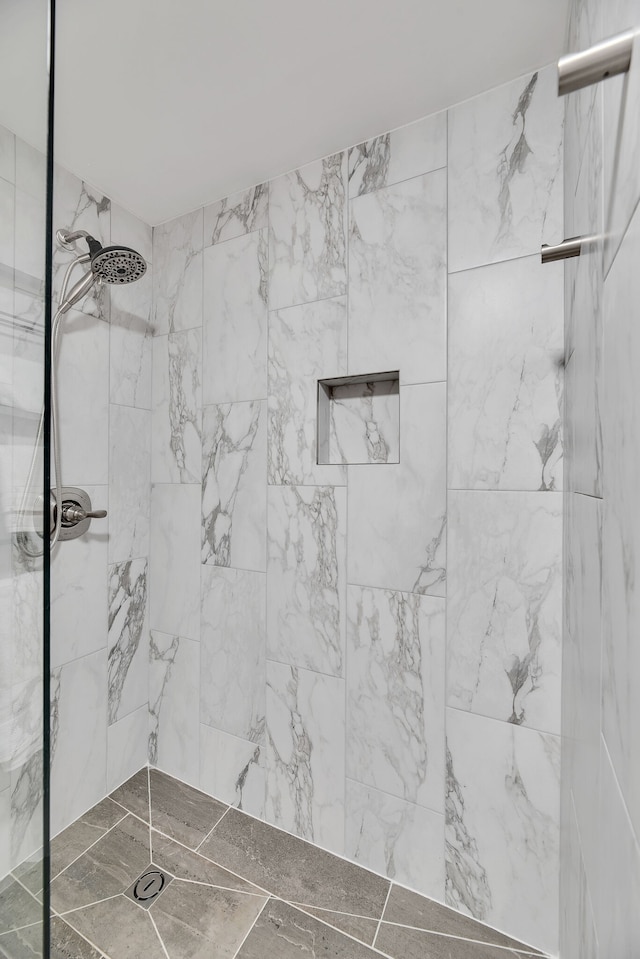 bathroom with tiled shower