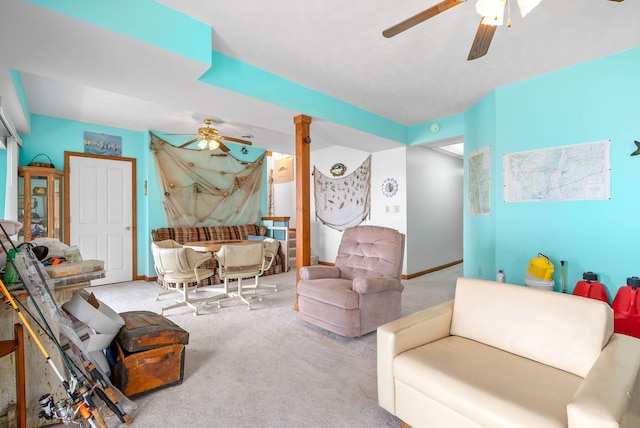 carpeted living room with ceiling fan