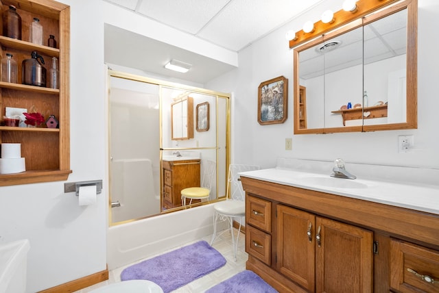 bathroom with shower / bath combination with glass door and vanity