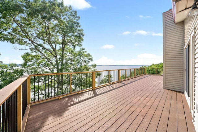 wooden deck with a water view