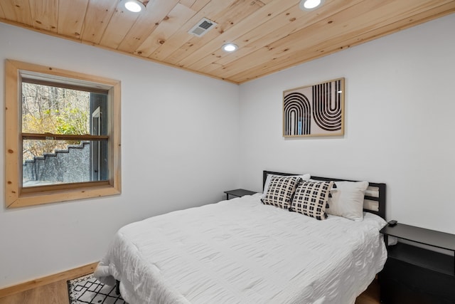 bedroom featuring wooden ceiling and hardwood / wood-style floors