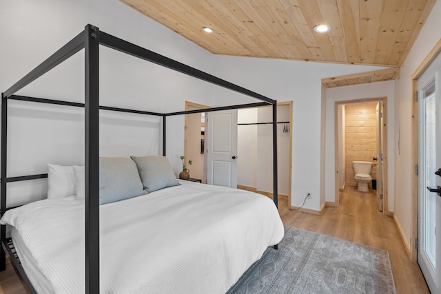 bedroom with lofted ceiling, ensuite bathroom, wood ceiling, and light wood-type flooring