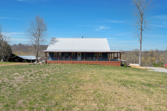 exterior space with a front lawn and a porch