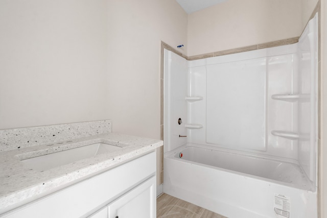 bathroom featuring vanity and shower / bathtub combination