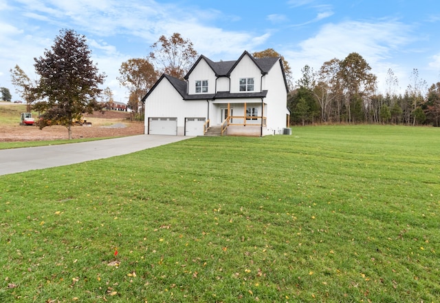 view of front of house with a front lawn, cooling unit, and covered porch