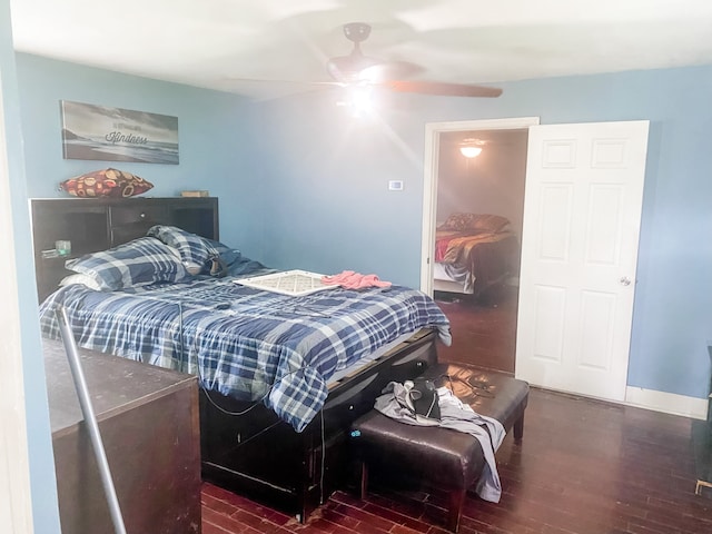 bedroom featuring ceiling fan and dark wood-type flooring