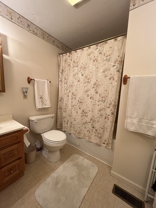 full bathroom featuring shower / bath combo, toilet, tile flooring, a textured ceiling, and vanity