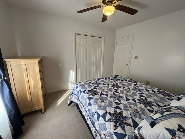 carpeted bedroom with a closet and ceiling fan