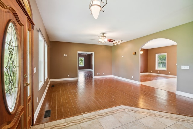 foyer featuring light hardwood / wood-style floors and ceiling fan