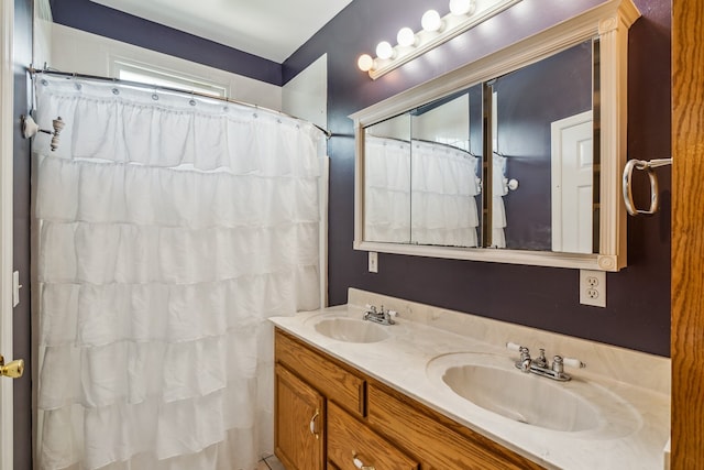 bathroom featuring oversized vanity and double sink