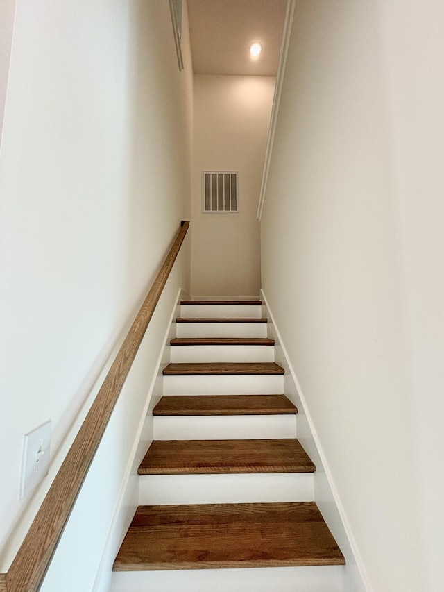 staircase with recessed lighting, visible vents, and baseboards