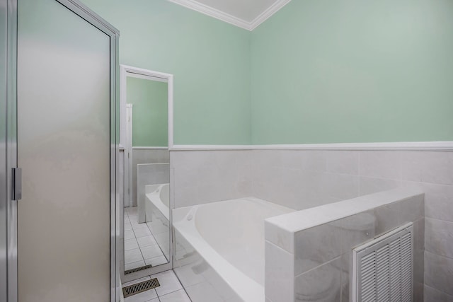 bathroom featuring tile walls, ornamental molding, tile floors, and tiled bath