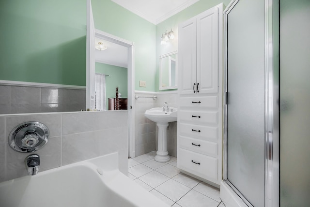 bathroom with tile walls, independent shower and bath, and tile flooring