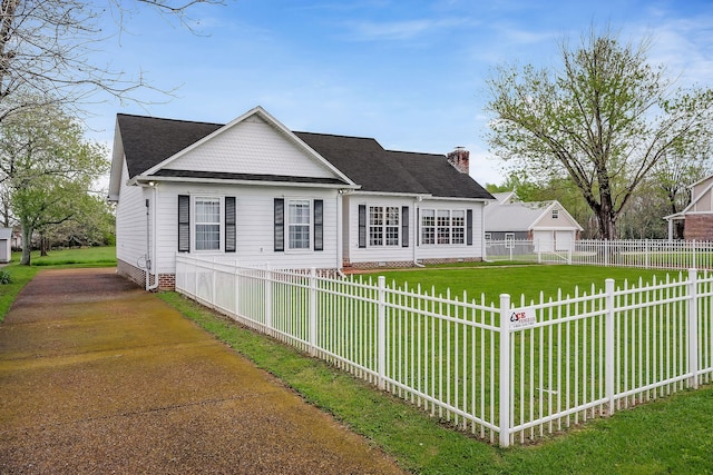 view of front of property with a garage and a front yard