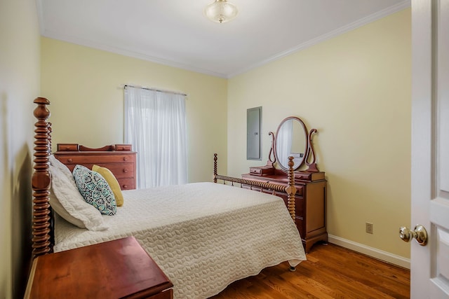 bedroom featuring crown molding and dark hardwood / wood-style flooring