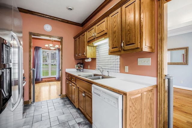 kitchen with crown molding, tile flooring, sink, a notable chandelier, and dishwasher