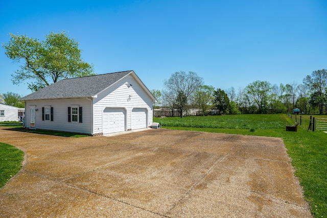 garage with a yard