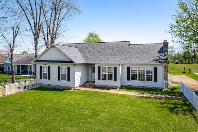 ranch-style house featuring a front lawn