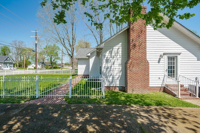 exterior space with a yard and central air condition unit