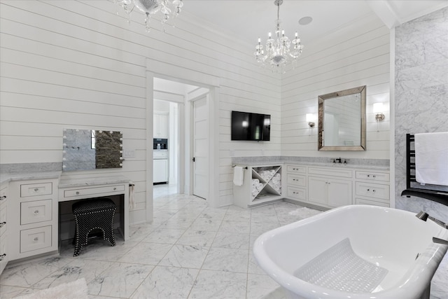 bathroom with a chandelier, a bath to relax in, wood walls, tile flooring, and vanity