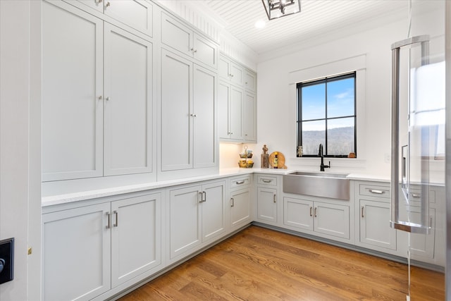 interior space with sink and light hardwood / wood-style floors