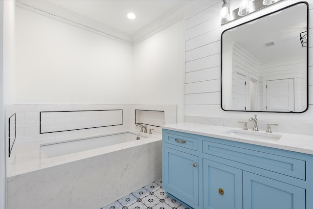 bathroom featuring tile floors, ornamental molding, a bath to relax in, and vanity