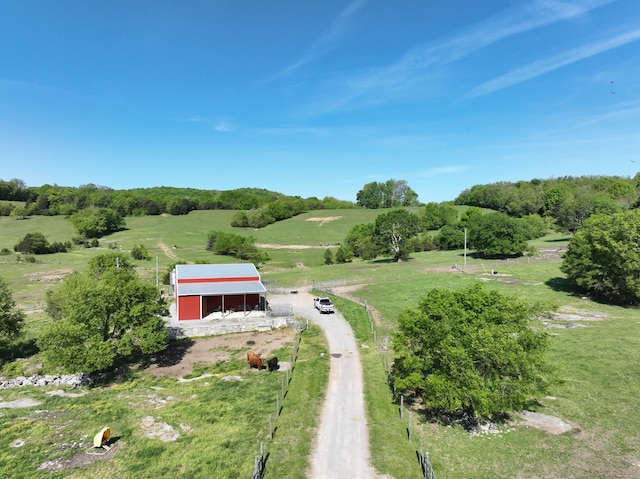 birds eye view of property with a rural view