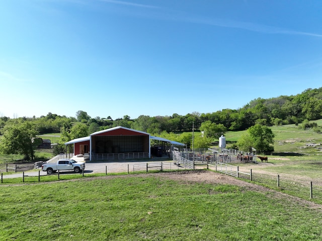 view of yard featuring a rural view and a carport